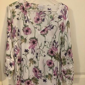 Pink and white flowered blouse .